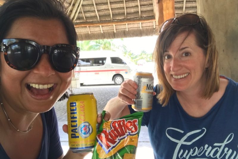 Stella and Fadra - snagging a beer and snack in Cozumel